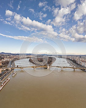 Aerial drone shot of Margret Bridge over Danube in Budapest winter morning with overcast