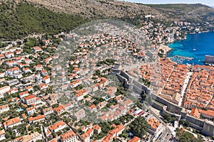 Aerial drone shot of Minceta Fort on Dubrovnik old town wall with view of stradun street in Croatia summer noon