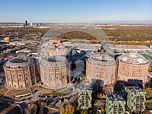 Aerial drone shot of Old Gasometer buidlings in Vienna from up above. Used like gasholders, it is music hall, museum