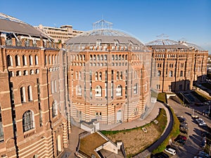 Aerial drone shot of Old Gasometer buidlings in Vienna from up above. Used like gasholders, it is music hall, museum