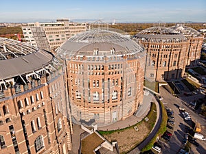 Aerial drone shot of Old Gasometer buidlings in Vienna from up above. Used like gasholders, it is music hall, museum