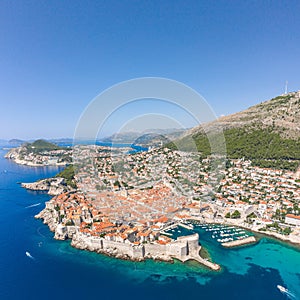 Aerial drone shot of Old Port in Dubrovnik old town in Croatia summer midday noon