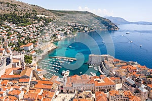 Aerial drone shot of Old Port in Dubrovnik old town in Croatia summer morning