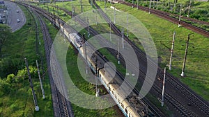 Aerial drone shot over railway. Aerial view of railroad in beautiful forest. Several paintings of the railway in the
