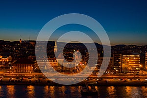 Aerial drone shot of St. Francis parish church by Danube in Budapest twilight