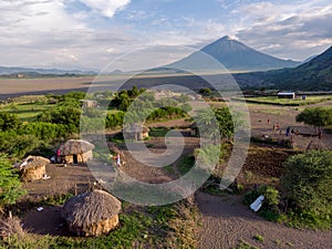 Aerial Drone Shot. Traditional Masai village at Sunset time near Arusha, Tanzania