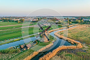 Aerial drone shot view of Kinderdijk Wind Mills in the filed near Rotterdam in Netherlands