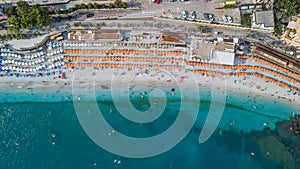 Aerial drone shot view of Monterosso beach filled with parasol in summer time