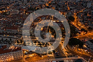 Aerial drone shot of west Diocletian Palace at dusk in Split old towni with lights before sunrise in Croatia