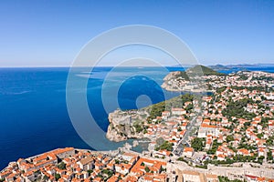 Aerial drone shot of west Dubrovnik with view of Fort Lovrijenac and Lapad peninsula in Croatia summer