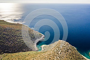 Aerial drone shot of yacht on Adriatic sea curvy cove on Vis Island in Croatia summer morning