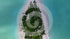Aerial drone sky of marine bay beach break by blue green lagoon and white sand background