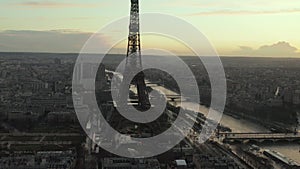 AERIAL: Drone Slowly Circling Eiffel Tower, Tour Eiffel in Paris, France with view on Seine River in Beautiful Sunset