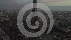 AERIAL: Drone Slowly Circling Eiffel Tower, Tour Eiffel in Paris, France with view on Seine River in Beautiful Sunset
