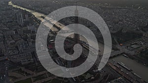 AERIAL: Drone Slowly Circling Eiffel Tower, Tour Eiffel in Paris, France with view on Seine River in Beautiful Sunset