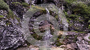 Aerial Drone - Summer landscape over an alpine waterfall