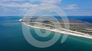 Aerial drone top down photo of seascape of island with sandy beach, turquoise clear waters of black sea in Ukraine and trees on