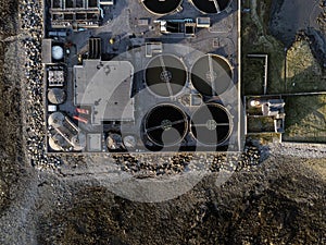 Aerial drone top down view on a biological sewage water treatment plant.