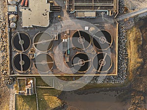 Aerial drone top down view on a biological sewage water treatment plant.