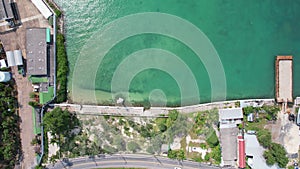 Aerial drone top down view of curves road near the harbor Phuket Thailand beautiful Top view sea. Drone shot over seashore Phuket