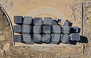 Aerial drone top down view on sanded new brick pavement with bricks stack stored for future use