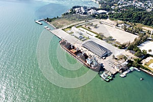 Aerial drone top view of containers cargo ship at industrial import-export port. Business logistic import and export freight