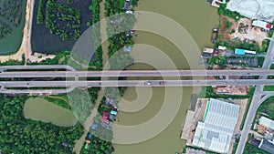 Aerial drone top view of highway junction road Bridge with moving cars Active movement of transport cars vehicles in different dir