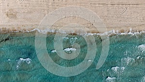 Aerial drone top view to the beach with white sand and blue sea. Luxury summer vacation and resort concept