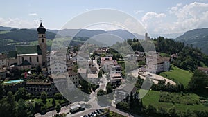 Aerial drone video of the city of VÃ¶ls am Schlern Fie allo Sciliar on the Italian Alps Dolomites