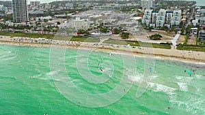 Aerial drone video Miami. Kite surfing on the beach