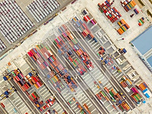 Aerial drone view above containers at dockyard.