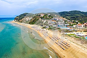 Aerial drone view of Agios Stefanos beach, a small tourist resort on the north east coast of Corfu in Greece