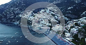 Aerial Drone View of Amalfi coast, shore port, docks and boats in the sea. Italy