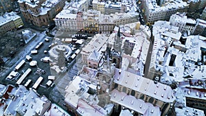 Aerial drone view of ancient gothic Church of Our Lady before Tyn in the Old Town square covered in snow
