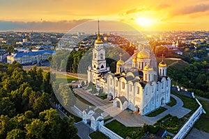 Aerial drone view of Assumption Cathedral in the city center of Vladimir with Klyazma river with summer sunny day sunset photo