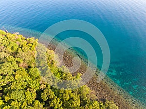 Aerial drone view of beautiful beach with turquoise sea water and trees of Gulf of Thailand. Kood island, Thailand.