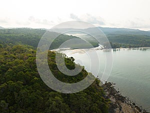 Aerial drone view of beautiful beach with turquoise sea water and trees of Gulf of Thailand. Kood island, Thailand.