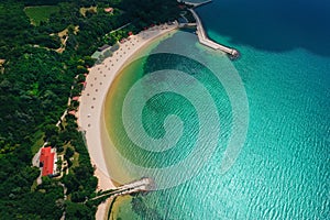 Aerial drone view of a beautiful beach with white sand and umbrellas. Summer holidays. Euxinograd, Varna. Bulgaria.