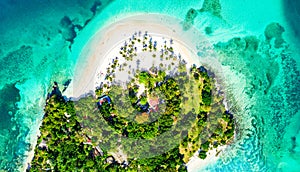 Aerial drone view of beautiful caribbean tropical island Cayo Levantado beach with palms. Bacardi Island, Dominican Republic.