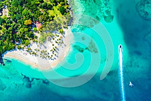 Aerial drone view of beautiful caribbean tropical island Cayo Levantado beach with palms and boat. Bacardi Island, Dominican