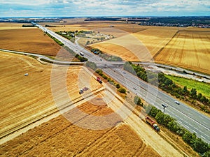 Aerial drone view of beautiful French countryside and six-lane motorway