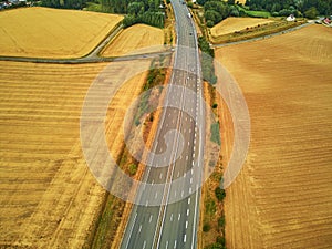 Aerial drone view of beautiful French countryside and six-lane motorway in France