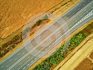 Aerial drone view of beautiful French countryside and six-lane motorway in France