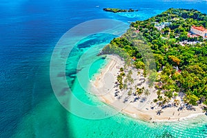 Aerial drone view of the beautiful small island and palm trees of Atlantic Ocean. Cayo Levantado island, Samana, Dominican