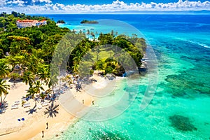 Aerial drone view of the beautiful small island and palm trees of Atlantic Ocean. Cayo Levantado island, Samana, Dominican