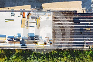 Aerial drone view on the bridge during construction. Concrete layer with material from above