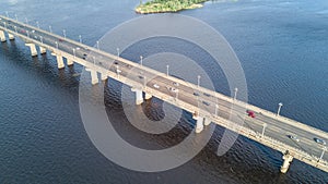 Aerial drone view of bridge road automobile traffic jam of many cars from above, city transportation