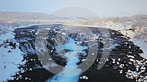 Aerial drone view of Bruarfoss waterfall in Winter, Iceland