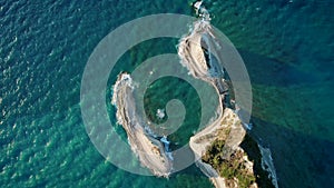 Aerial drone view of Cape Drastis - rock formation, Corfu, paradise island in Greece. Ionian Sea with azure clear water