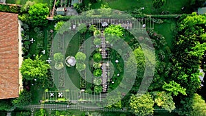 Aerial drone view captures the serene elegance of a summer wedding dinner held outdoors.